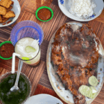 Grilled seafood with rice and local dishes served on a table, representing Gili Air best restaurants and authentic island dining experience