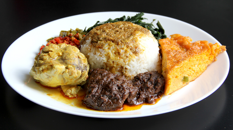 Nasi Padang with rice, chicken, beef rendang, egg and vegetables, a popular choice of Halal food in Bali.