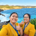 Two travelers enjoying Nusa Penida while sharing their experience on how to get to Nusa Penida from Bali.